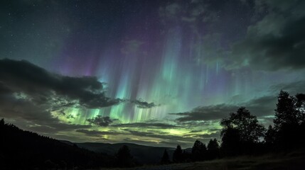 Stunning Aurora Borealis Illuminates Night Sky Over Dark Landscape