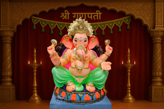 Hindu God Ganesha on colourful background, Ganesha Idol. Ganesh festival.