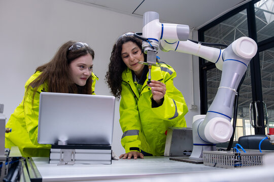 Exciting collaboration between students and technology in robotics lab at a modern educational facility