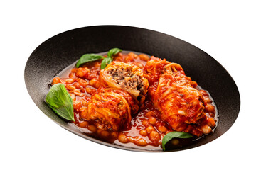 Stuffed cabbage tomato sauce with beans meat, cabbage, fresh delicious gourmet food background on the table rustic food top view copy space