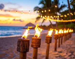 Burning tiki torches on a beach at sunset