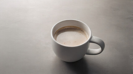 cup of coffee on wooden table