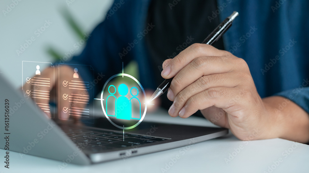 Aufkleber close-up of a hand using a laptop with an ai interface for candidate targeting, representing digital