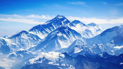 Obraz premium Cloudy, landscape, range, snow, scenery, mountain, blue sky and white clouds: Peaks Kissing Blue Skies & White Clouds, Where Snow-Clad Summits Paint Breathtaking Scenery Across Vast Mountain Ranges.