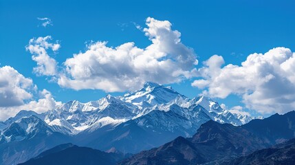 Fototapeta premium Cloudy, landscape, range, snow, scenery, mountain, blue sky and white clouds: Peaks Kissing Blue Skies & White Clouds, Where Snow-Clad Summits Paint Breathtaking Scenery Across Vast Mountain Ranges.