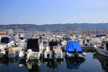 Motor and sailing boats moored in the marina