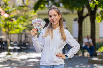 Successful rich Caucasian girl gambler gambling addiction business woman winner wins, holding fan...