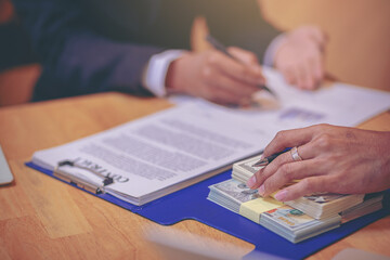 Business Negotiation concept: Businessman presents marketing plan to attract business partner to invest in project. Selected focus
