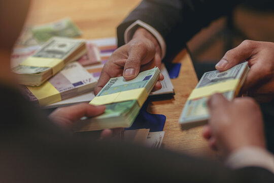 Exchange money, Business peoople exchange Europe money (Euro) for Dollars money. Business exchange and investment concept.