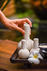 Soft and select focus Spa massage compress balls, herbal ball and treatments spa on the wooden; Spa...