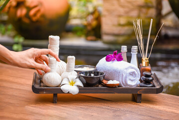 Soft and select focus Spa massage compress balls, herbal ball and treatments spa on the wooden; Spa...