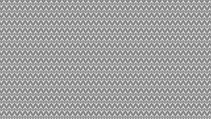 A repeating pattern of triangles and diamonds in black and white creating a dense texture effect