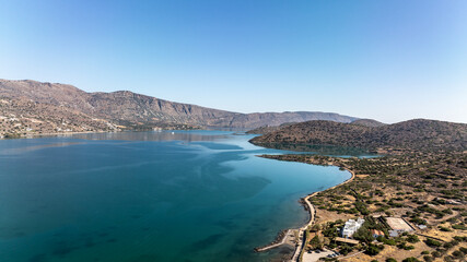 panoramic drone view of coastal sea water and rocky shore near Crete island