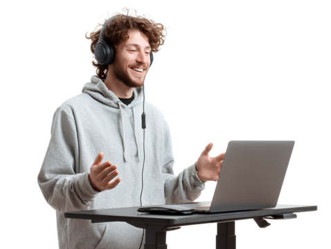 Smiling Remote Worker with Headphones and Laptop at Standing Desk, Mid-Action Pose, Isolated on Transparent Background (2)