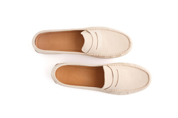 Suede moccasins in neutral beige tones with handcrafted detail, perfect for fashion e-commerce, advertising, boutique catalogs, or minimalist branding campaigns