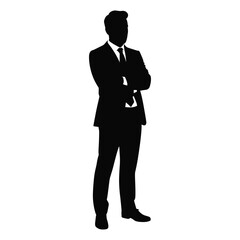 Silhouette of a confident businessman standing with arms crossed