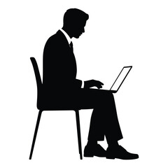 Silhouette of a businessman working on a laptop while sitting on a chair