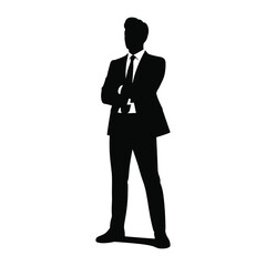 Silhouette of a confident businessman standing with arms crossed