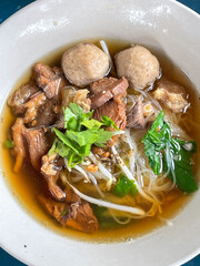 The closed up of Thai noodles with meat ball. 