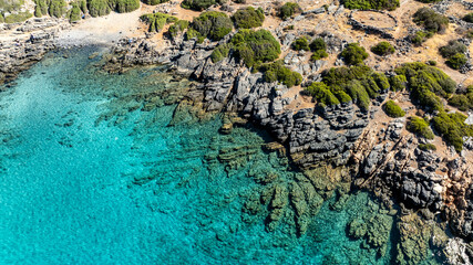 panoramic drone view of coastal sea water and rocky shore near Crete island