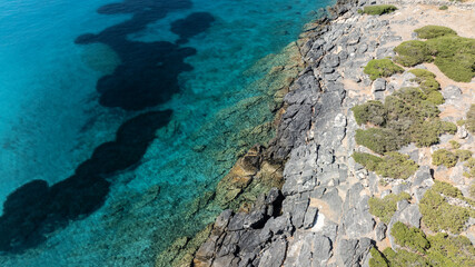 panoramic drone view of coastal sea water and rocky shore near Crete island