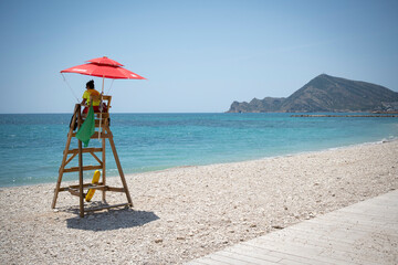 tropical beach with lifeguard