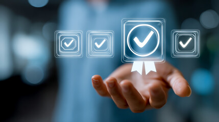 A hand holding virtual screens with a checkmark icon and a badge medal for quality, standard, or safety