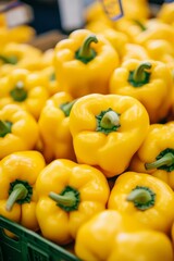 Vibrant yellow bell pepper displayed on market counter, showcasing its freshness and texture