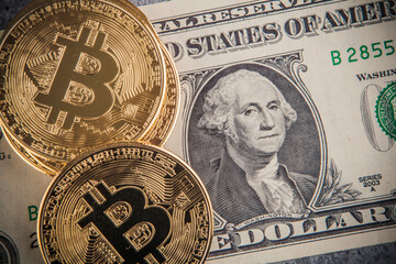 Bitcoin and dollar banknotes. Cryptocurrency concept. Selective focus. Toned.