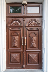 Classic double door with brown patterns.