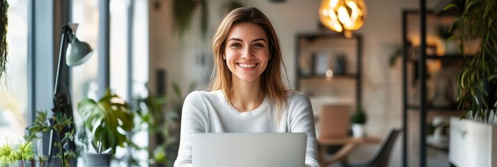 Smiling woman in modern office environment.