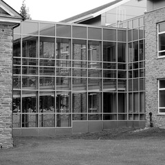The modern office building with a lot of glass.