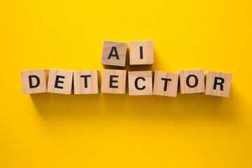 Ai detector written with wooden cubes on yellow background
