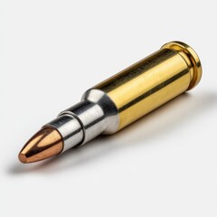 Close up of a rifle bullet, shiny and gold, isolated on white background.