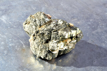 Shooting of specimen of natural mineral - pebble of pyrite (iron pyrite, fool's gold) stone...