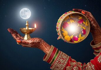 Karwa Chauth Celebration Woman s Hands with Henna Lamp and Thali under the Full Moon