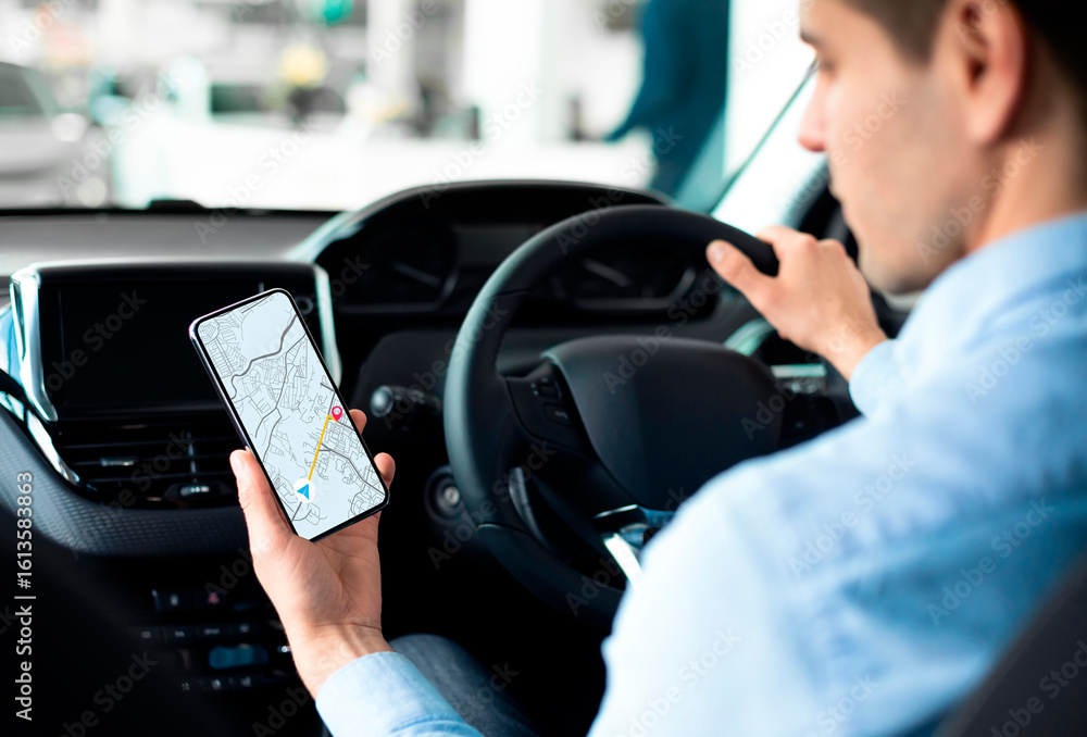 Poster young man using gps service navigation app on smartphone while driving car, checking route to final 
