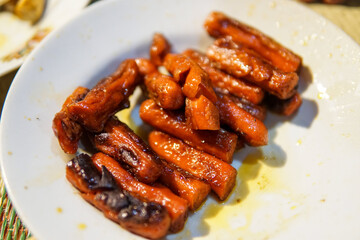 Glazed Sausages on a Plate with Golden Brown Edges
