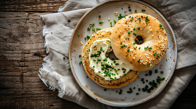 Toasted Bagel with Cream Cheese and Fresh Chives on Ceramic Plate