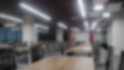 blurred, atmospheric image of a modern office interior. 