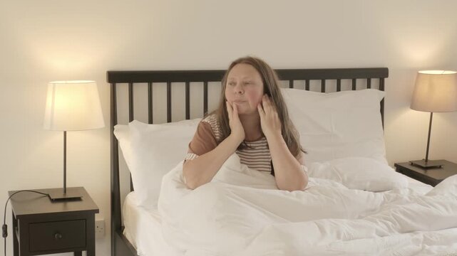 Tired Sleep-deprived woman lies in bed struggles with insomnia, unable to sleep. Sleep disorder, overthinking, restless thoughts deprivation, mental health, sleeping issues, disturbances