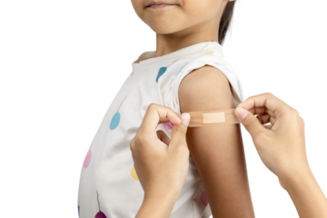 Doctor or parent applying a bandage to a child's arm after vaccination. Pediatrics and child healthcare isolated on white background with clipping path.