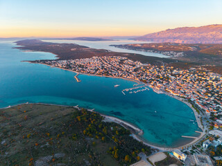 Aerial view of Pag island and Novalja town at sunset