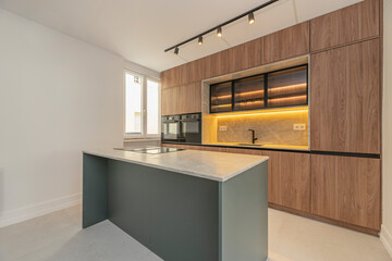 Modern kitchen with rustic touches: distressed wood, natural wood accents, and ample natural light