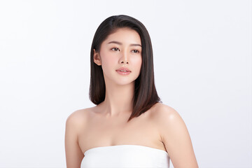 A beautiful young Asian woman with clean, fresh skin against a white background. Skincare, facial...