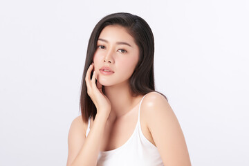 A beautiful young Asian woman with clean, fresh skin against a white background. Skincare, facial...