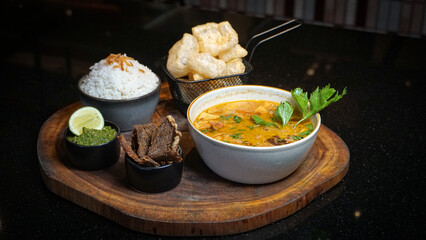 Traditional Indonesian Soto with Dendeng, Rice, and Crackers
