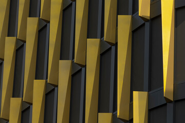 This is a detailed closeup view of a striking black and yellow building that features an...