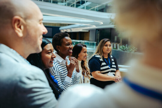 Corporate colleagues interacting in a modern office environment