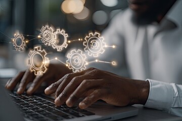 Close-up of person's hands typing on laptop with digital gears overlay